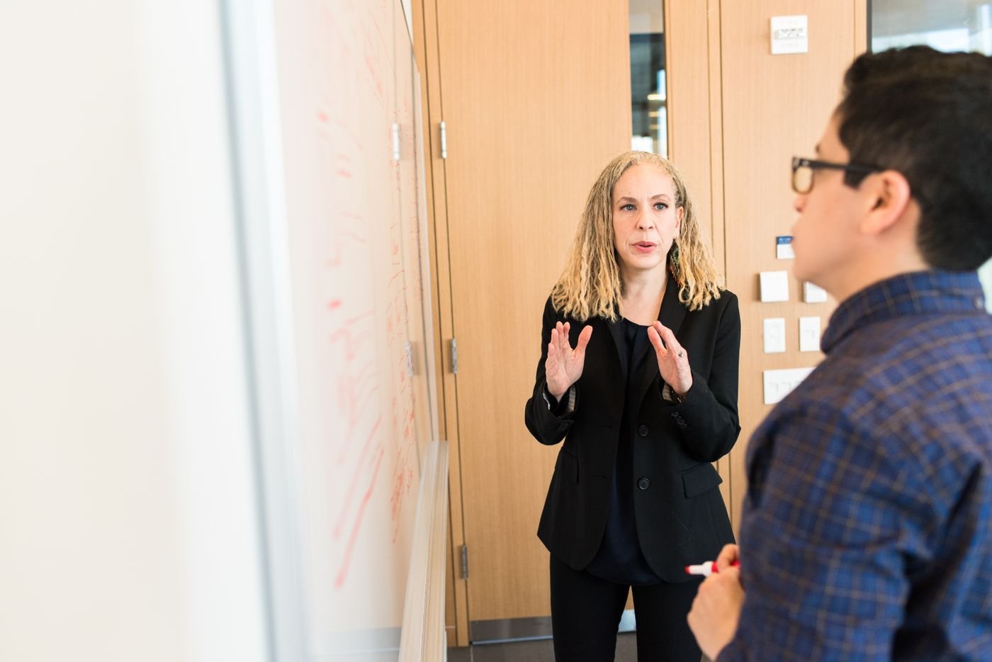An educator explaining ideas during a small workshop