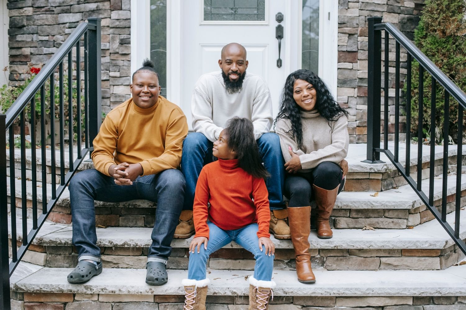 Family enjoying time on their front steps